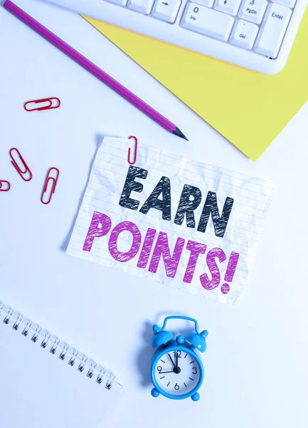 Text sign showing Earn Points. Business photo text collecting scores in order qualify to win big prize Flat lay above white blank paper with copy space for text messages