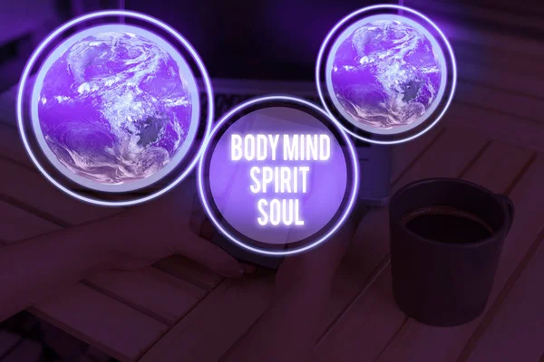 Handwriting text writing Body Mind Spirit Soul. Concept meaning Personal Balance Therapy Conciousness state of mind Elements of this image furnished by NASA.