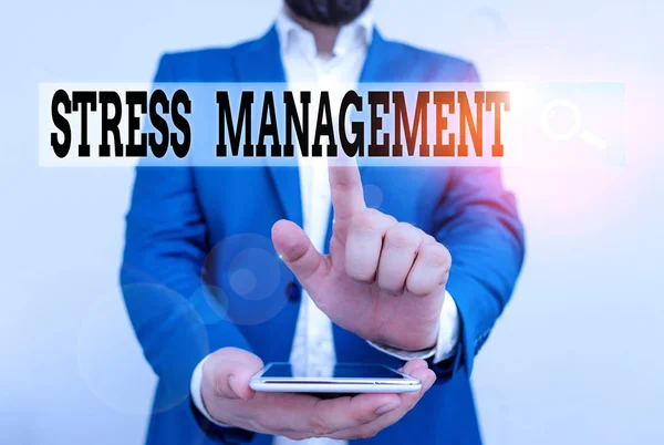 Text sign showing Stress Management. Business photo text method of limiting stress and its effects by learning ways Businessman in the blue suite with lap top pointing with finger