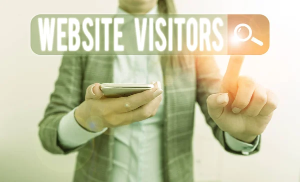 Text sign showing Website Visitors. Business photo showcasing someone who visits views or goes to your website or page Business concept with mobile phone and business woman