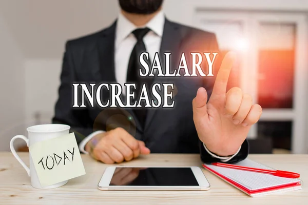 Conceptual hand writing showing Salary Increase. Business photo text an increase in the salary or pay given to an employee Male human wear formal clothes present use hitech smartphone.