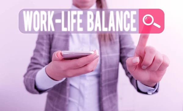 Text sign showing Work Life Balance. Business photo showcasing time allocated for work and aspects of life are equal Business concept with mobile phone and business woman