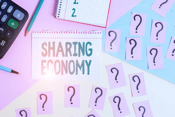 Text sign showing Sharing Economy. Business photo showcasing collaborative consumption or peer to peer based sharing Mathematics stuff and writing equipment above pastel colours background