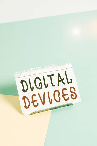 Text sign showing Digital Devices. Business photo text physical unit of equipment that contains a microcontroller Paper placed tilted above buffer wire on soft pastel multi colours backdrop