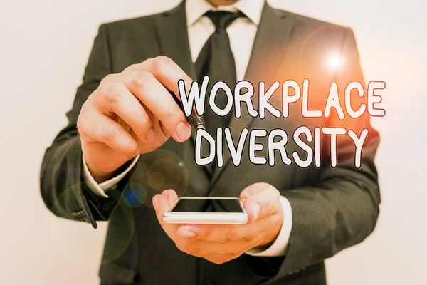 Handwriting text Workplace Diversity. Concept meaning environment that accepts each individual differences Male human wear formal work suit hold smart hi tech smartphone use one hand.
