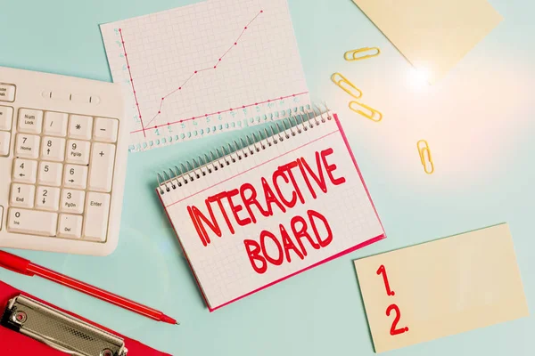 Word writing text Interactive Board. Business photo showcasing standalone touchscreen computer used independently Paper blue desk computer keyboard office study notebook chart numbers memo