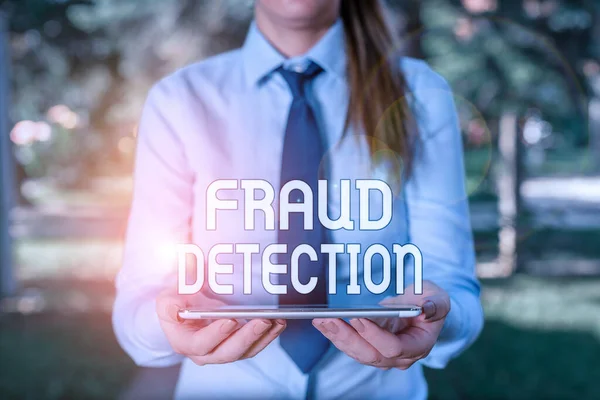 Text sign showing Fraud Detection. Conceptual photo identification of actual or expected fraud to take place Business woman in shirt with a tie holding lap top mobile phone in the hand. — Stockfoto