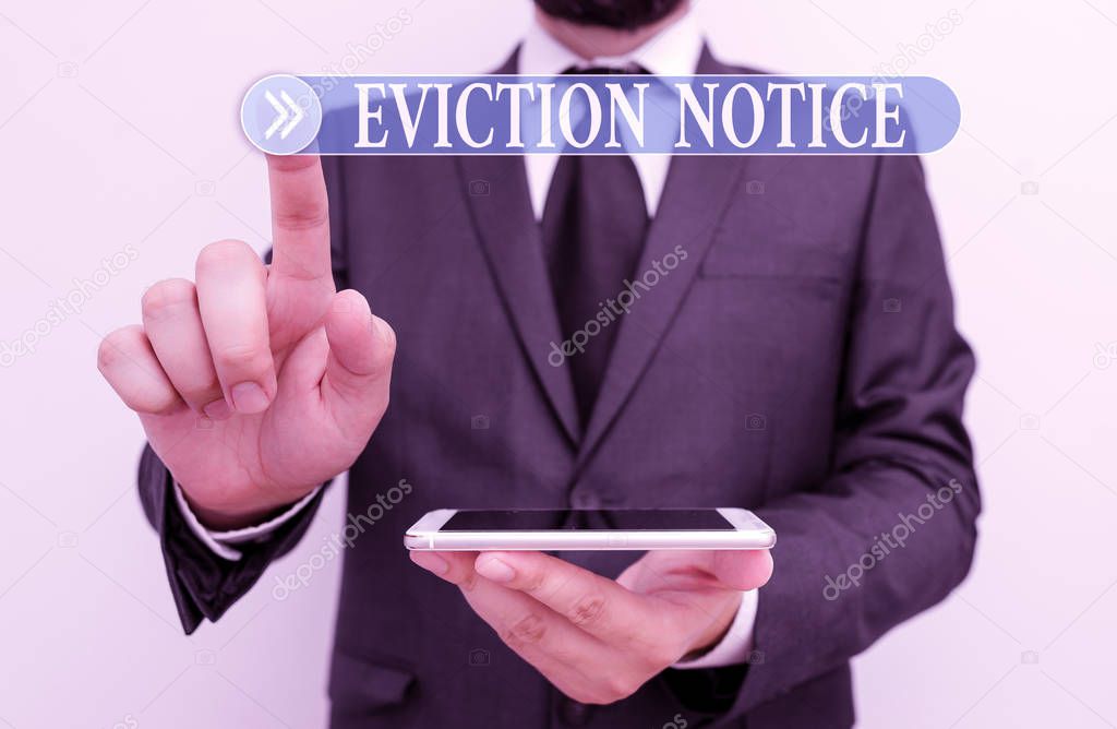 Word writing text Eviction Notice. Business concept for an advance notice that someone must leave a property Male human wear formal work suit hold smart hi tech smartphone use one hand.
