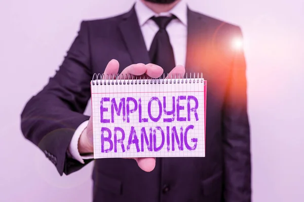 Handwriting text writing Employer Branding. Concept meaning process of articulating your company unique message Male human wear formal work suit office look hold mathematics book use hand.