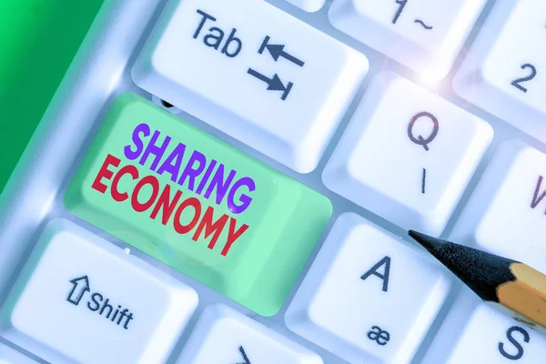 Word writing text Sharing Economy. Business photo showcasing collaborative consumption or peer to peer based sharing
