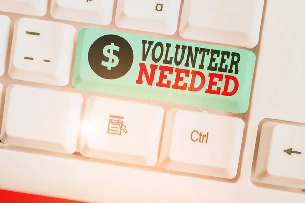 Writing note showing Volunteer Needed. Business concept for need work or help for organization without being paid