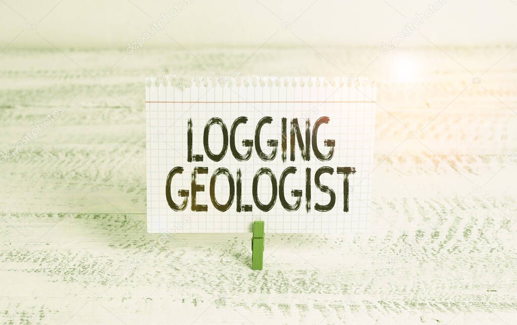 Writing note showing Logging Geologist. Business concept for Layout and execution of definition diamond drill programs Green clothespin white wood background reminder office supply