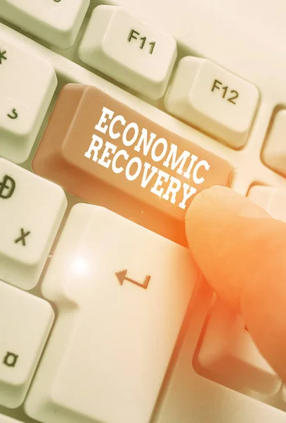 Writing note showing Economic Recovery. Business photo showcasing rise of business activity signaling the end of a recession. — Stock Photo, Image