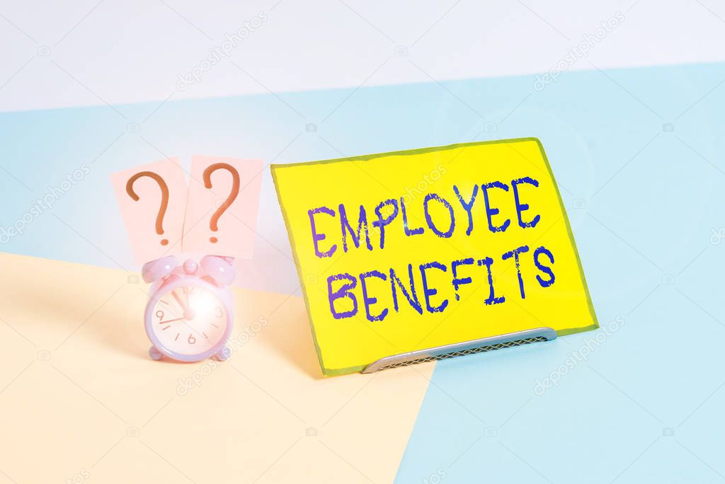 Word writing text Employee Benefits. Business photo showcasing payments made to employees beyond the scope of wages Mini size alarm clock beside a Paper sheet placed tilted on pastel backdrop