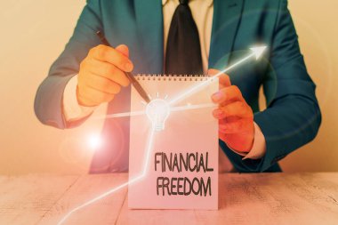 Finansal özgürlüğü gösteren kavramsal el yazısı. Kavram demek para hakkında stres olmadan büyük kararlar vermek demektir.