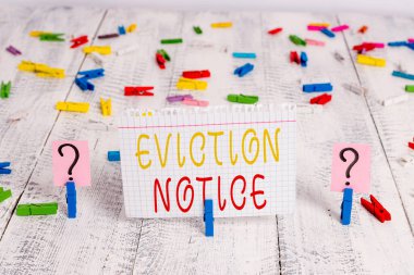 Word writing text Eviction Notice. Business photo showcasing an advance notice that someone must leave a property Scribbled and crumbling sheet with paper clips placed on the wooden table clipart