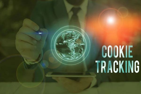 Conceptual hand writing showing Cookie Tracking. Concept meaning Data stored in the user computer by website being visited Elements of this image furnished by NASA