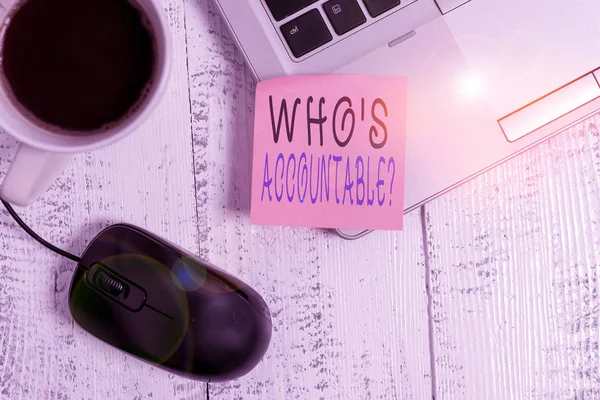 Word writing text Who S Accountable. Business photo showcasing answerable for something within one power or control Trendy metallic laptop blank sticky note coffee cup mouse lying vintage