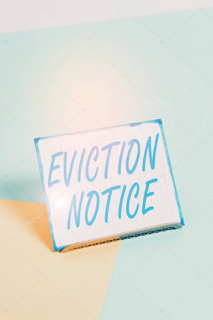Conceptual hand writing showing Eviction Notice. Concept meaning an advance notice that someone must leave a property Paper on buffer wire on soft pastel multi colours backdrop