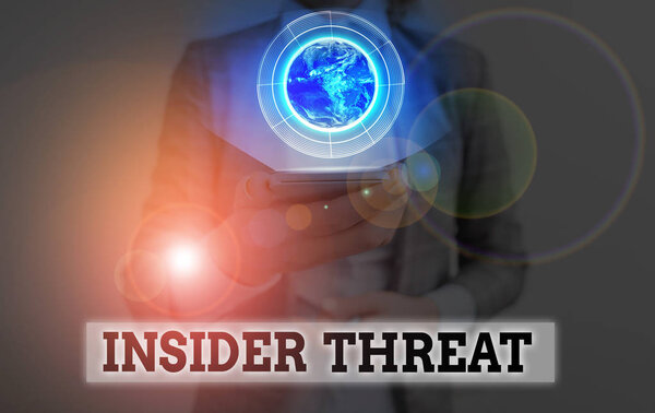 Conceptual hand writing showing Insider Threat. Concept meaning security threat that originates from within the organization Elements of this image furnished by NASA