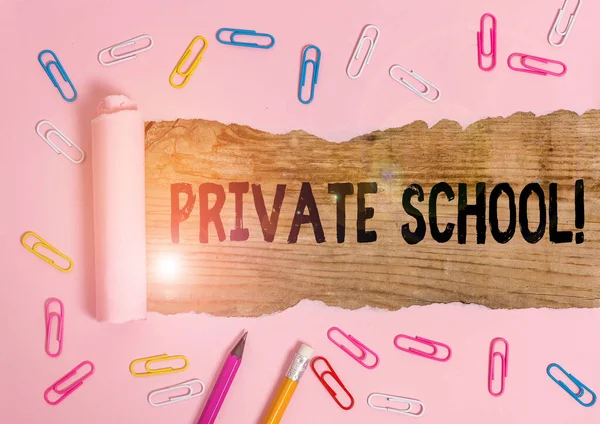 Text sign showing Private School. Conceptual photo an independent school supported wholly by the payment of fees Stationary and torn cardboard placed above a wooden classic table backdrop. — ストック写真
