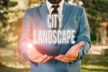 Word writing text City Landscape. Business concept for photograph of the physical aspects of a city or urban area Man with opened hands stands in suite. Concept with copy space and man.