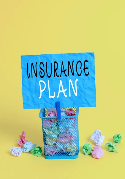 Writing note showing Insurance Plan. Business photo showcasing something showing buy to protect themselves from losing money Trash bin crumpled paper clothespin office supplies yellow.