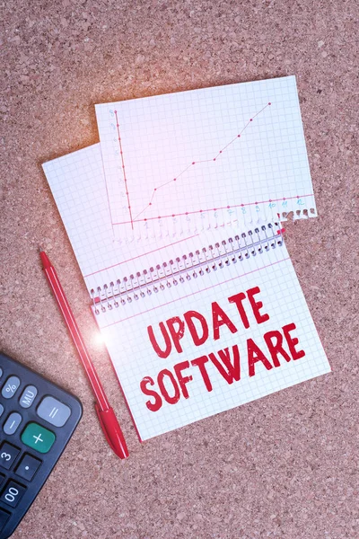 Writing note showing Update Software. Business photo showcasing adds minor software enhancements and compatibility Desk notebook paper office paperboard study supplies chart.