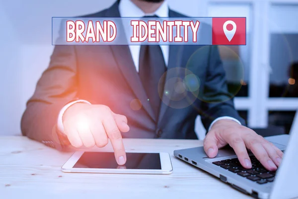 Text sign showing Brand Identity. Conceptual photo visible elements of a brand that identify and distinguish Male human wear formal clothes present presentation use hi tech smartphone.