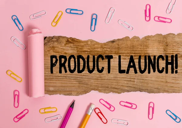 Text sign showing Product Launch. Conceptual photo process to introduce new product for sale for the first time Stationary and torn cardboard placed above a wooden classic table backdrop.