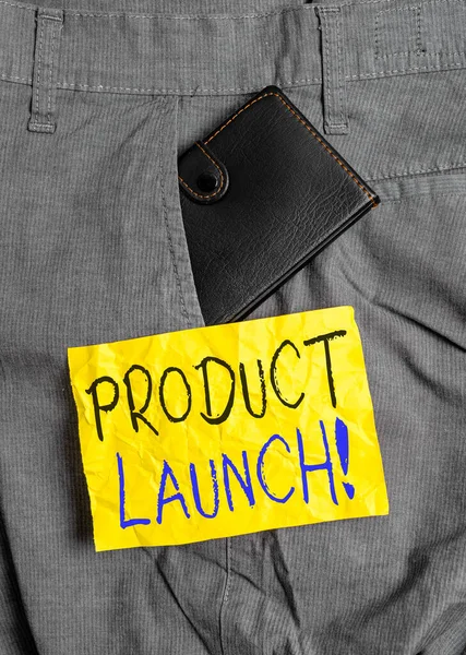 Word writing text Product Launch. Business concept for process to introduce new product for sale for the first time Small little wallet inside man trousers front pocket near notation paper. — Stockfoto