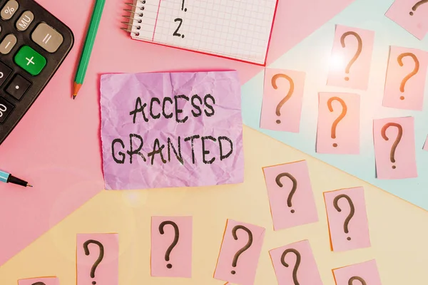Text sign showing Access Granted. Conceptual photo admittance of users to system and network resources Mathematics stuff and writing equipment above pastel colours background.
