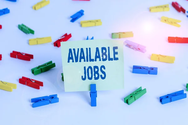 Word writing text Available Jobs. Business concept for a job that is available for someone to start doing Vacancy Colored clothespin papers empty reminder white floor background office. — Stock Photo, Image
