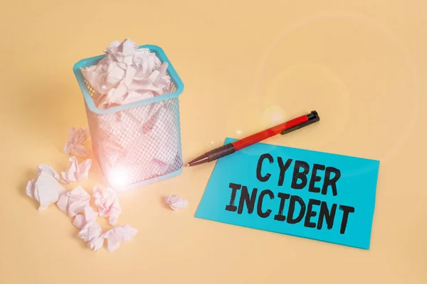 Word writing text Cyber Incident. Business concept for warning that there may be a threat to information security crumpled paper trash and stationary with note paper placed in the trash can. — Stock Photo, Image