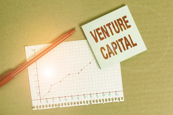 Handwriting text writing Venture Capital. Concept meaning capital invested in a project in which there is risk Desk notebook paper office cardboard paperboard study supplies table chart.