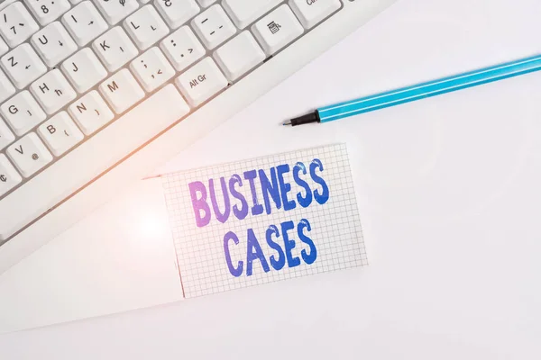 Text sign showing Business Cases. Conceptual photo undertaking on the basis of its expected commercial benefit White pc keyboard with empty note paper above white background.