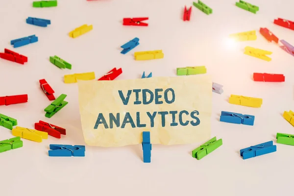 Handwriting text writing Video Analytics. Concept meaning analyzing video to detect and determine temporal event Colored clothespin papers empty reminder white floor background office. — Stock Photo, Image