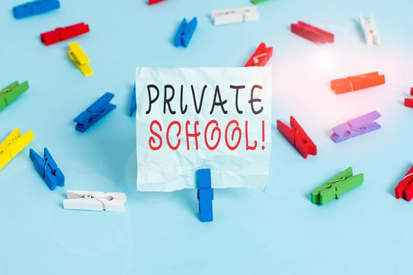 Conceptual hand writing showing Private School. Business photo text an independent school supported wholly by the payment of fees Colored clothespin papers empty reminder blue floor officepin.