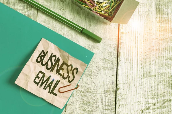 Writing note showing Business Email. Business photo showcasing the email which you use specifically for your business Wrinkle paper and cardboard placed above wooden background.
