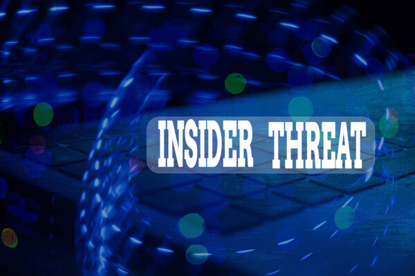 Handwriting text Insider Threat. Concept meaning security threat that originates from within the organization.
