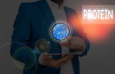 Proteini gösteren bir not yazıyorum. Nasa tarafından desteklenen bu görüntünün düşük yağ ve karbonhidrat tüketim kilo verme planlarını gösteren iş fotoğrafı.