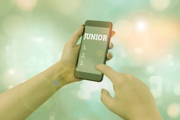 Text sign showing Junior. Conceptual photo erson who is a specified number of years younger than someone else. — Stock Photo, Image