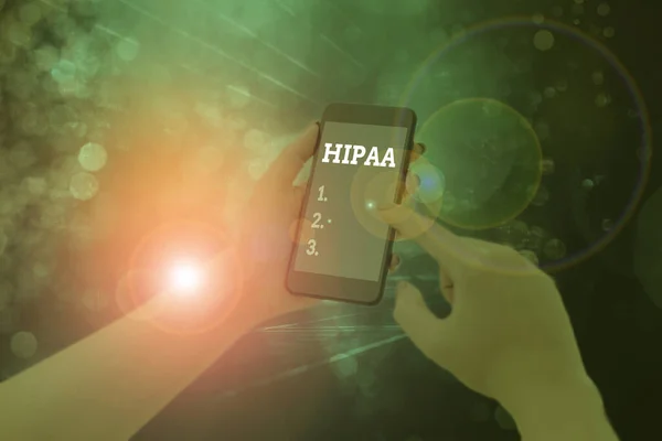 개념적 손을 보여주는 Hipaa 쓰기입니다. 건강 보험 이동성 책임에 대 한 비즈니스 사진 텍스트 약어 의미. — 스톡 사진