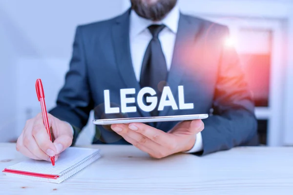 Word writing text Legal. Business concept for Allowable or enforceable by being in conformity with the law Male human wear formal clothes present presentation use hi tech smartphone. — Stock Photo, Image