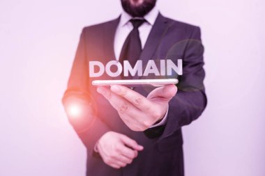 El yazısı metni alan adı. Kavram, belirli bir hükümdar ya da hükümet tarafından kontrol edilen bir bölge anlamına gelir. Erkek insan resmi iş kıyafeti giyer. Akıllı yüksek teknoloji akıllı telefon kullan..