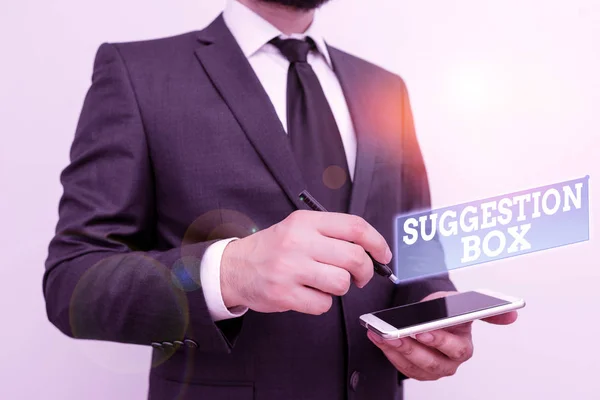 Text sign showing Suggestion Box. Conceptual photo container which showing can leave comments about something Male human wear formal work suit hold smart hi tech smartphone use one hand. — 스톡 사진