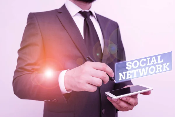 Text sign showing Social Network. Conceptual photo a network of social interactions and demonstratingal relationships Male human wear formal work suit hold smart hi tech smartphone use one hand. — Stockfoto