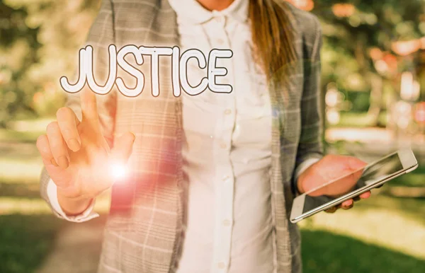 Conceptual hand writing showing Justice. Business photo showcasing Quality of being just impartial or fair Administration of law rules Business woman sitting with mobile phone and cup of coffee. — Stockfoto