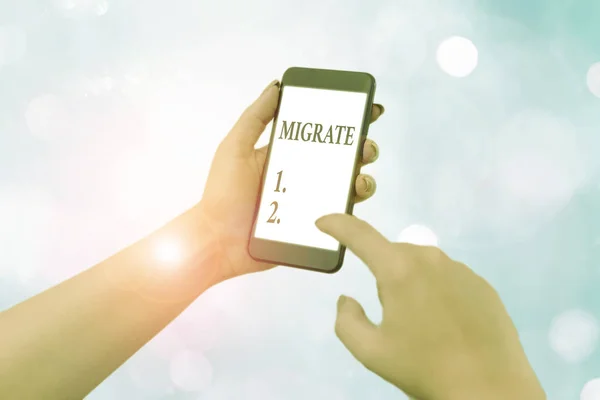 Handwriting text writing Migrate. Concept meaning to move or travel from one country place or locality to another. — Stock Photo, Image