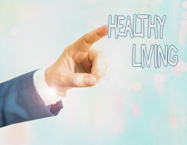 Handwriting text writing Healthy Living. Concept meaning way of living that lowers the risk of being seriously ill.